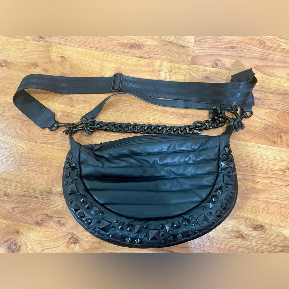 Black faux leather crossbody with chain and studs. L 15” H 10” W 3”